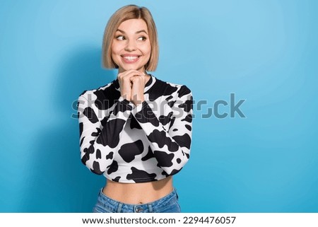 Portrait of gorgeous positive person arms under chin beaming smile look empty space isolated on blue color background Royalty-Free Stock Photo #2294476057