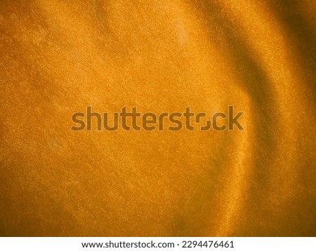 Yellow velvet fabric texture used as background. Empty yellow fabric background of soft and smooth textile material. There is space for text.	