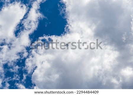 Aircraft flying in the clouds over the island of Corfu in Greece