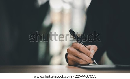 Learning for conference room ideas Business report document, businessman manager writing at company on desk to read Sign a document or document file,contract concept Ready to sign various transactions