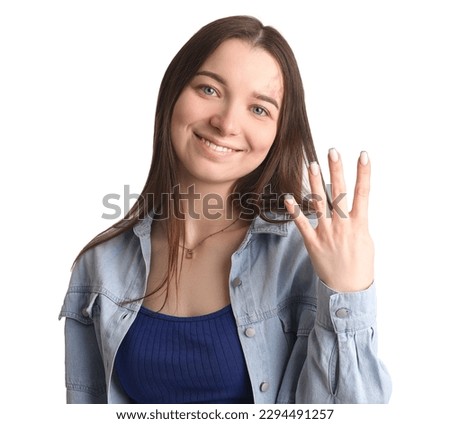 Young woman in shirt showing four fingers on white background