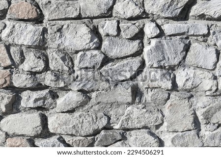 This is a photo of white stone wall. This is a stone background texture
