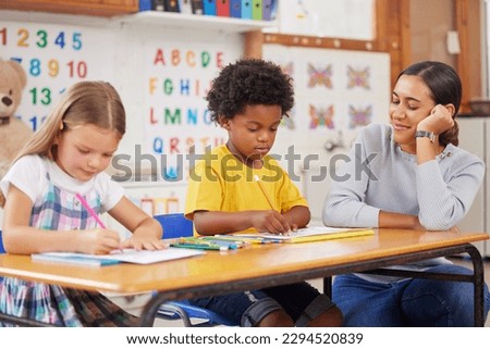 I just love watching their little achievements. Shot of a young woman teaching a class of preschool children. Royalty-Free Stock Photo #2294520839