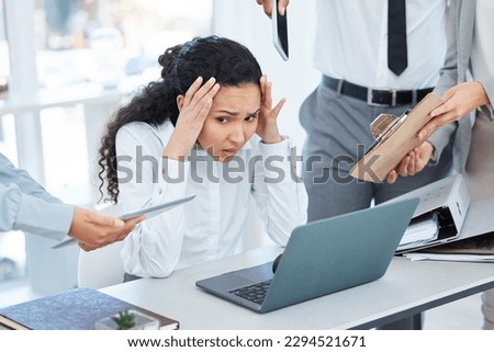 Cant hide from all the work. Shot of a young businesswoman feeling overwhelmed in a demanding work environment. Royalty-Free Stock Photo #2294521671