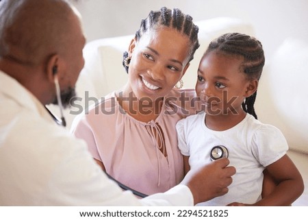 African american male paediatrician examining sick girl with stethoscope during visit with mom. Doctor checking heart lungs during checkup in hospital. Smiling daughter receiving medical care Royalty-Free Stock Photo #2294521825