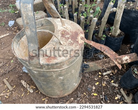 Solo-Surakarta, April 27 2023 Antique galvanized garden bucket for watering plants.
