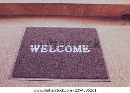 Welcome carpet on floor in condo.