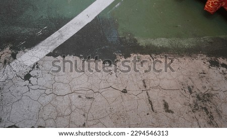 Cracked basketball court floor with line background