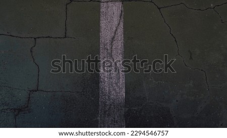 Cracked basketball court floor with vertical line background
