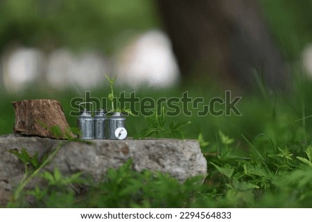 milk can in the garden with lovely background 