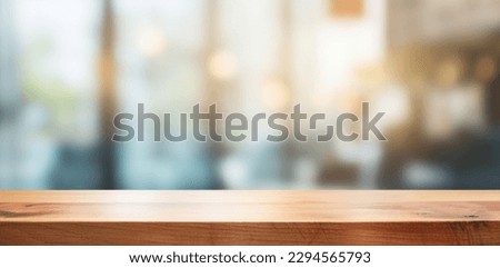 Wood table top on blurred green background - can be used for montage or display your products