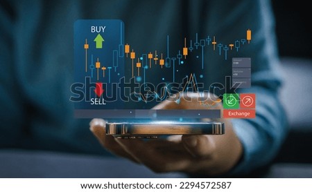 Successful of trader use phone trading stock exchange graph money, global economic, trader investor,graph money of block chain stock market cryptocurrency selling and buy with price chart data graph Royalty-Free Stock Photo #2294572587