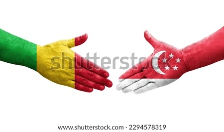 Handshake between Mali and Singapore flags painted on hands, isolated transparent image.