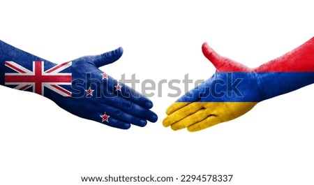Handshake between Armenia and New Zealand flags painted on hands, isolated transparent image.