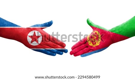 Handshake between Eritrea and North Korea flags painted on hands, isolated transparent image.