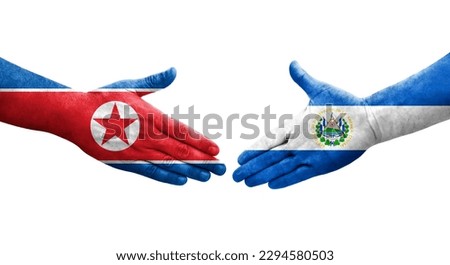 Handshake between El Salvador and North Korea flags painted on hands, isolated transparent image.