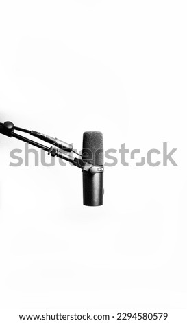 Podcast audio music mic against a blank white background with plenty of negative space for copy and text as a poster and promotion. 