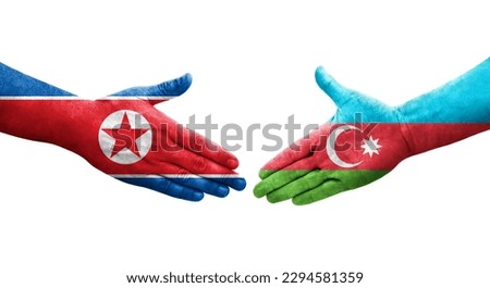 Handshake between Azerbaijan and North Korea flags painted on hands, isolated transparent image.
