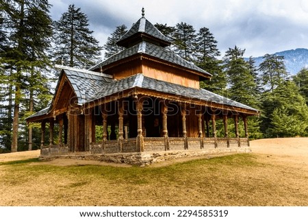 Shangchul mahadev temple in the meadow of Shahgarh, surrounded by Deodar Tree and Himalayas mountains in Sainj Valley, Great Himalayan National Park, Himachal Pradesh, India	 Royalty-Free Stock Photo #2294585319