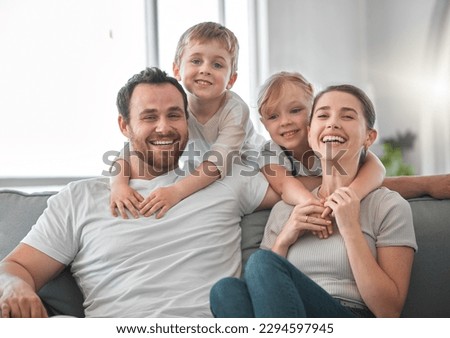 Rejoice with your family in the beautiful land of life. Shot of a young couple spending time with their children. Royalty-Free Stock Photo #2294597945