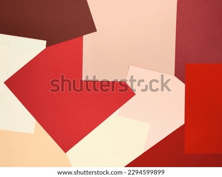 lots of red pink beige paper squares