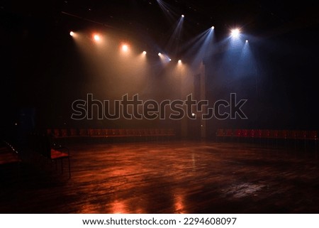 Empty dance floor in orange lighting with reflecting ground Royalty-Free Stock Photo #2294608097