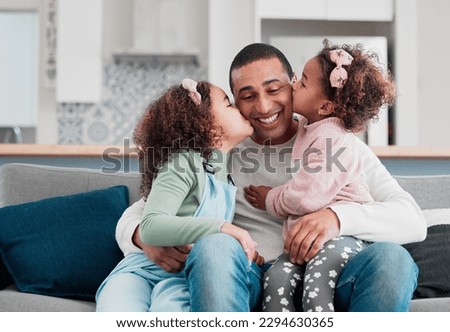 Nobody prepared me for how much love I have for them. Shot of two little girls giving their father a kiss on the cheek at home.