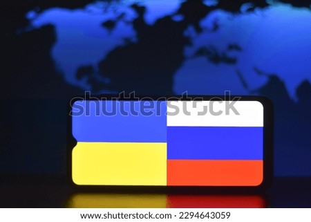 Closeup view of the Russia and Ukraine flag on the smartphone screen stock image