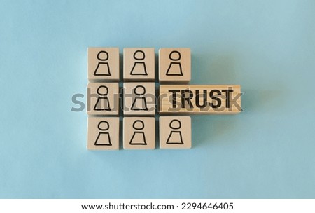 Wooden Blocks with the text: Trust, Building trust in business concept. Royalty-Free Stock Photo #2294646405