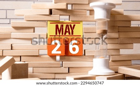 May 26 calendar date text on wooden blocks with blurred nature background. Copy space and calendar concept
