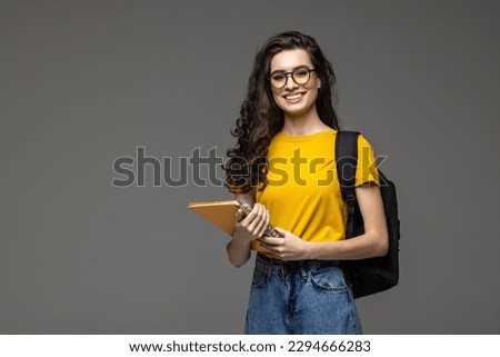 Young happy student with backpack on white Royalty-Free Stock Photo #2294666283