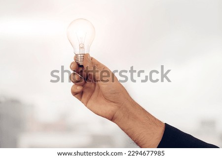 Businessman holding light bulb. Idea concept with innovation and inspiration.  businessman holding illuminated light bulb. Brain creative thinking ideas and innovation concept.