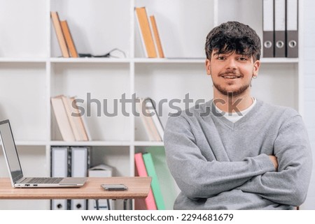 smiling student in library or desk