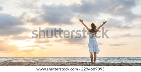 Beautiful girl in dress staying by the sea. Royalty-Free Stock Photo #2294689095