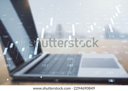 Multi exposure of creative statistics data hologram on laptop background, stats and analytics concept