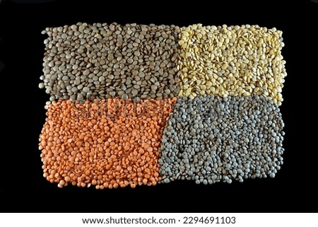 Four types of lentils forming a picture on a black background.