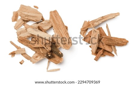 closeup of two piles of cedar or palo santo incense, wood chips isolated over a white background, top view, flat lay Royalty-Free Stock Photo #2294709369