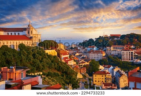 Lisbon panorama of sunset. Portugal. Evening picturesque with beautiful sky and sunny light at houses historic old town in district Alfama Lisboa Royalty-Free Stock Photo #2294733233