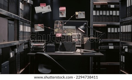 Criminal evidence board in private investigation office, map on wall filled with crime scene photos and clues. Police archive room with background check papers and forensic evidence.