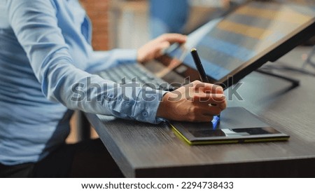 Female photographer working as retoucher with tablet and stylus pen, using photo editing software to fix color grading for multimedia production. Creative artist developing design. Close up.