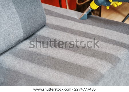 Sofa before and after wet - cleaning indoors. textile sofa vacuum cleaning. professional cleaning service concept. Royalty-Free Stock Photo #2294777435