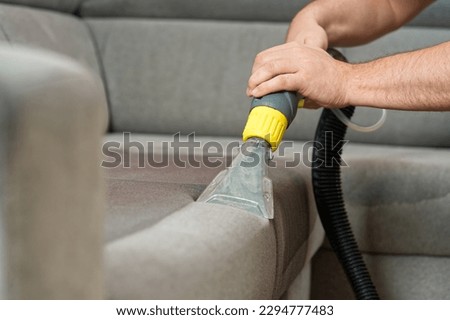 Sofa before and after wet - cleaning indoors. textile sofa vacuum cleaning. professional cleaning service concept. Royalty-Free Stock Photo #2294777483