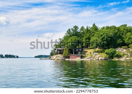 House on an island in the Thousand Islands National Park in the USA Royalty-Free Stock Photo #2294778753