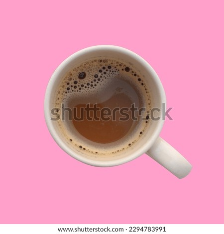 cup of hot coffee on pink background.