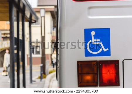 Wheelchair symbol, handicapped, physically challenged and disabled on the shutter bus.