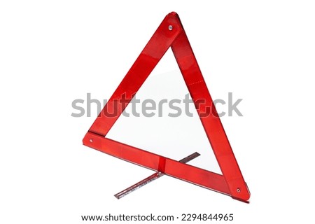 Emergency stop sign, warning triangle folded on white background