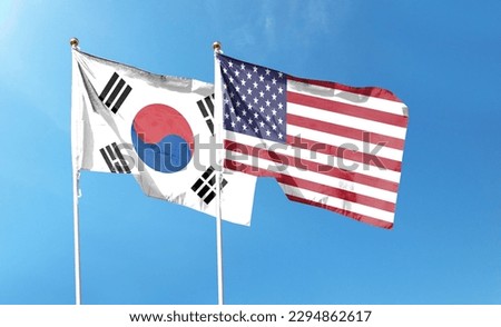 American flag and South Korean flag on cloudy sky. waving in the sky Royalty-Free Stock Photo #2294862617