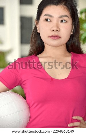 Unemotional Chinese Female Volleyball Player With Volleyball Royalty-Free Stock Photo #2294863149