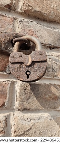  old rusty lock on the wall