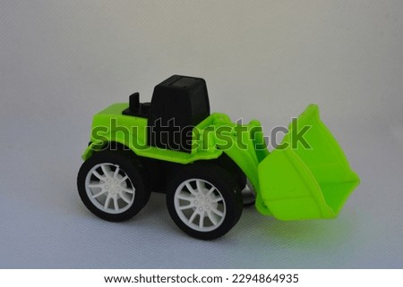 Plastic Green and Black Toy, Simple Toy for Child, Construction Toy set Green and Black isolated on white background.